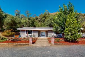 a house with a staircase leading to the front door at Sweeping Views! Charming Home Near Dtwn Jamestown in Jamestown
