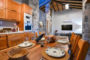 a dining room with a table and a kitchen at Villa Skylight Göcek Fethiye in Fethiye