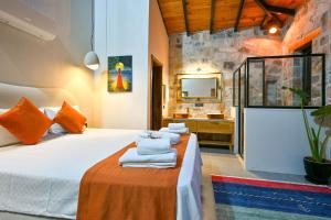 a bedroom with a bed and a bathroom with a sink at Villa Skylight Göcek Fethiye in Fethiye +42 photos