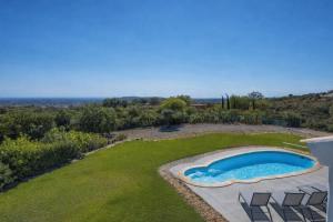 an overhead view of a swimming pool in a yard at Paradise Villa Cabanita Loulé in Loulé +32 photos