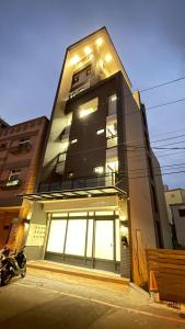 a tall building with a lot of windows at Hualien Leo and Alley Elevator B&B in Hualien City