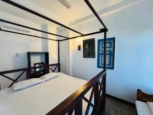 a bedroom with two beds in a room at Hotel Lean at 83 in Ahangama