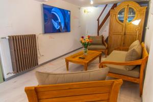 a living room with a couch and a table at Casa Torre Adults Only storia e relax a Fiorenzuola in Fiorenzuola di Focara
