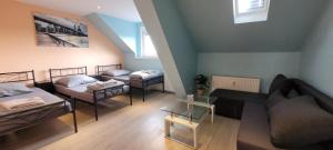 a living room with two beds and a couch at Privilege - Viel inklusiv! in Viersen