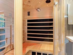 a sauna with a glass door in a room at 4 Bed in Kippford oc-95234 in Kippford +31 photos