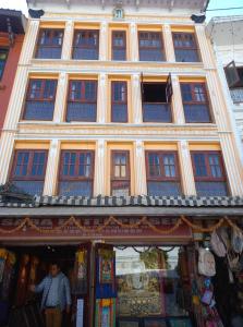 a man standing in front of a building at Serenity stay in Kathmandu