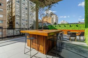a bar on the roof of a building at Soul República - Cidade Baixa in Porto Alegre