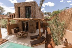 a villa with a swimming pool and a house at Na Xamena in La Croix-Valmer