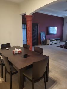 a dining room with a table and chairs at Steco rental in Amasaman
