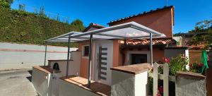a small house with an awning on the side of it at Casina Luce in Stiava