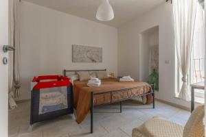 a bedroom with a bed with a table and a fireplace at Maison de Sisine in Capurso