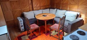 a room with a couch and a table and chairs at Apartman Buco in Livno +21 photos