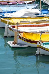 a group of boats sitting in the water at Le Mistral par Dodo-a-Cassis in Cassis