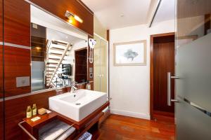 a bathroom with a white sink and a mirror at Le Mistral par Dodo-a-Cassis in Cassis