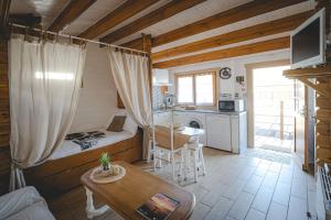 a small room with a bed and a table at Chalet in Le Teich