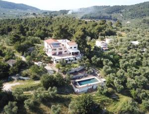 an aerial view of a house with a swimming pool at Zia Nì Boutique Suites in Peschici