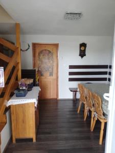 a room with a table and chairs and a dining room at David Linea House in Volavlje +13 photos