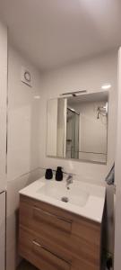 a bathroom with a sink and a mirror at Calpe vistas al mar in Ifach +12 photos