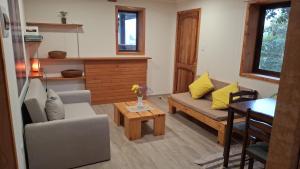 a living room with a couch and a table at El gran Jacarandá in Viña del Mar +26 photos