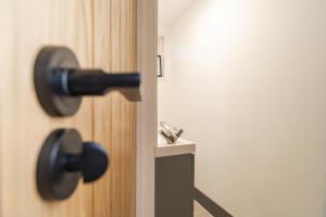 a close up of a door with a door knob at Willow retreat in Royal Tunbridge Wells +24 photos