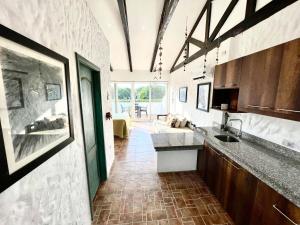 a kitchen with a sink and a counter top at Punta Blanca Ocean Suites in Santa Elena