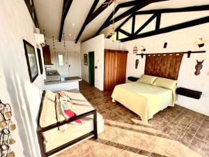 a bedroom with a bed and a couch in a room at Punta Blanca Ocean Suites in Santa Elena +15 photos