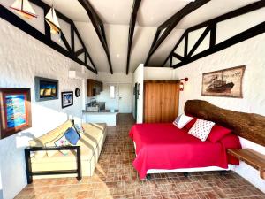 a living room with a bed and a couch at Punta Blanca Ocean Suites in Santa Elena