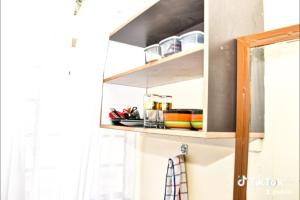 a shelf with dishes on it in a kitchen at Rymach homes in Eldoret