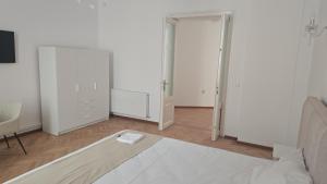 an empty room with a bed and a closet at Vila BELVEDERE in Brăila