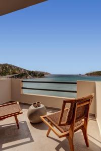 a room with chairs and a view of the ocean at Armia Experience Hotel in Vári +89 photos