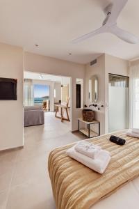 a bedroom with two beds and a view of the ocean at Armia Experience Hotel in Vári