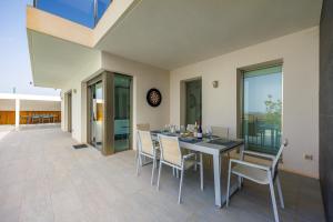 a dining room with a table and chairs at Villa Sophia in Busot
