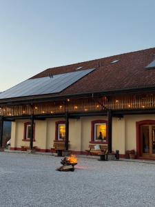 a building with a bunch of solar panels on it at AGRITURISMO MODOLO Belluno Dolomiti in Belluno