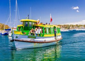a group of people on a boat in the water at Coastal & Connected Summer Resort Parking in Cronulla +5 photos