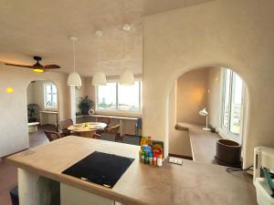 a kitchen and living room with a table and chairs at local diamond in Guía de Isora