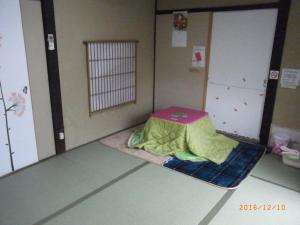 Postel nebo postele na pokoji v ubytování Oyajino Umi