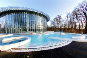 a large swimming pool in front of a building at Table Rase chambres d'hôtes, restaurant et weekend aux Thermes de Spa in Theux +47 photos