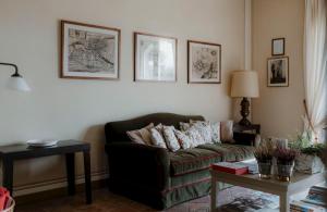 a living room with a couch and a table at Relais dei Poderi Einaudi in Dogliani