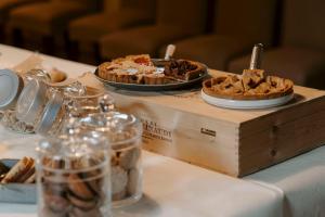 a table with two pies on top of a table at Relais dei Poderi Einaudi in Dogliani