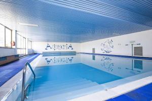 a large swimming pool with a large swimming pool at Appartamento Ato La Gerbia in Cannobio