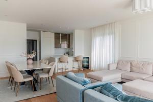a living room with a couch and a table at Adria Concept Suites in Zadar