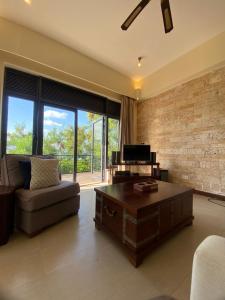 a living room with a couch and a coffee table at Mandharini UNIT 35 in Kilifi