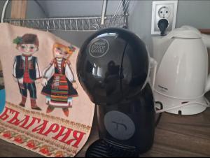a black blender sitting on a table next to a lamp at Къща за гости Странджа in Malko Tŭrnovo