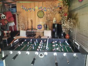 a ping pong table with ping pong paddles at Tinyhaus am Flughafen, der DLR und ESA in Cologne