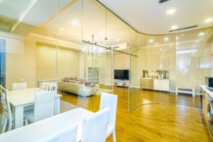 a dining room and kitchen with a table and chairs at Luxury Home VIP Chaila Tower in Baku +58 photos