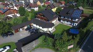 an overhead view of a house with a solar roof at Pension Sydler in Bad Goisern