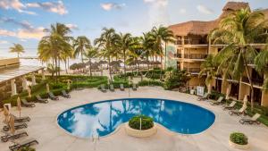an image of the pool at the resort at Catalonia Yucatan Beach - All Inclusive in Puerto Aventuras