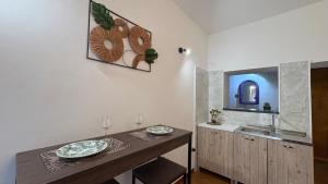 a kitchen with a wooden table and a sink at Casa Vacanze "La Casetta" in Configni +20 photos