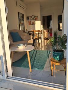 a living room with a couch and a table at MiLA - Hladna Uvala in Utjeha