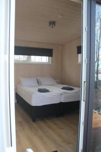 a bedroom with a large bed in a room at Svala Guesthouses in Selfoss